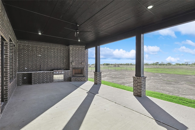 view of patio / terrace with a rural view and area for grilling