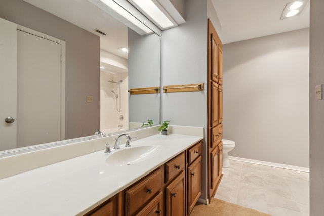 bathroom with tile patterned floors, a shower, vanity, and toilet