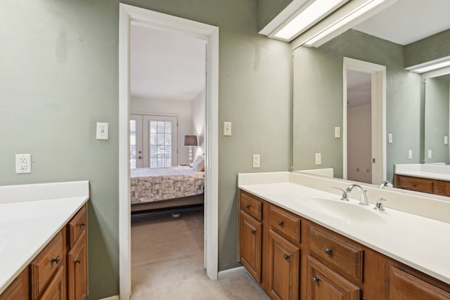 bathroom featuring french doors and vanity