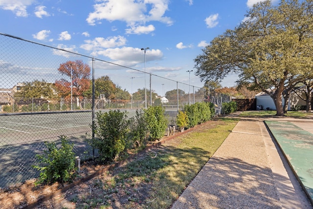 exterior space featuring tennis court