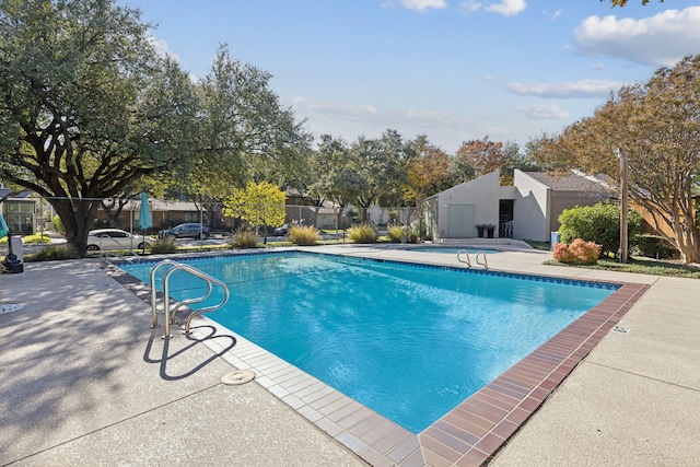 view of swimming pool featuring a patio