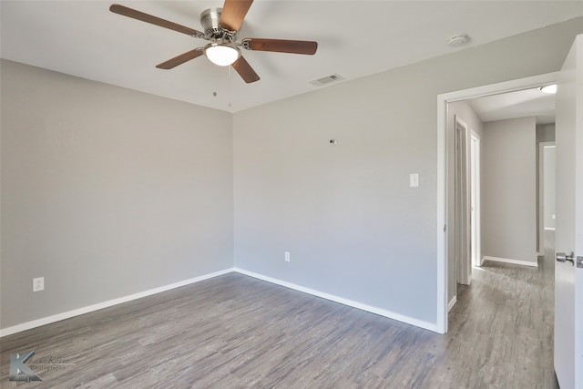 unfurnished room featuring ceiling fan and wood-type flooring