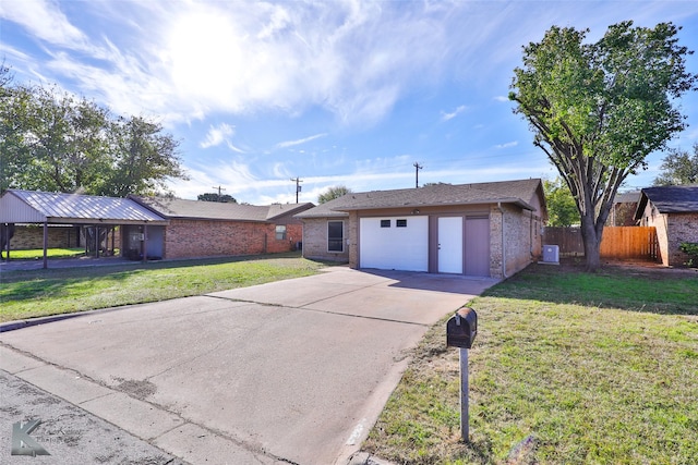 single story home featuring an outdoor structure and a front lawn