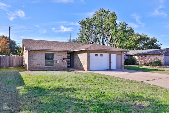 single story home with a garage and a front lawn