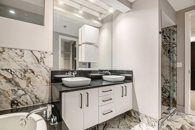 bathroom with beam ceiling, vanity, independent shower and bath, and tile walls