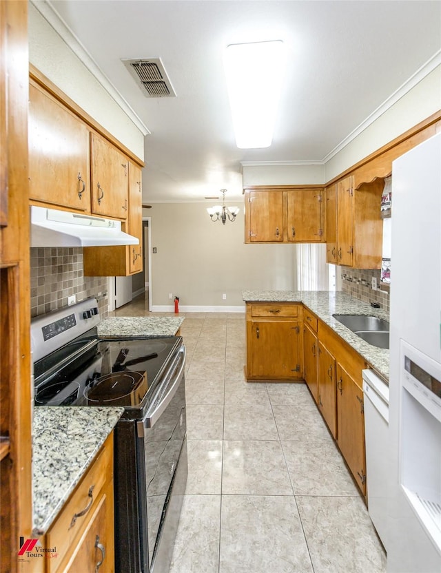 kitchen featuring kitchen peninsula, white appliances, crown molding, sink, and a notable chandelier