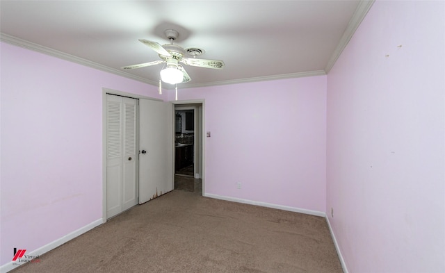 unfurnished bedroom with a closet, ceiling fan, ornamental molding, and light colored carpet