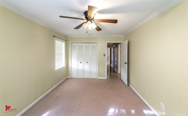 unfurnished bedroom featuring light carpet, a closet, ceiling fan, and crown molding