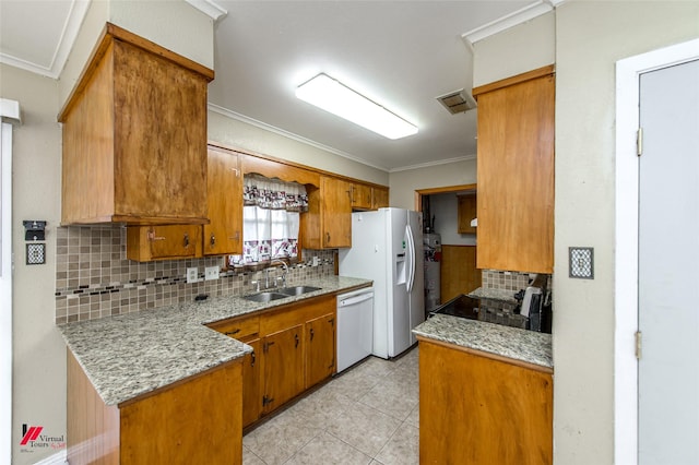 kitchen with ornamental molding, white appliances, sink, and tasteful backsplash