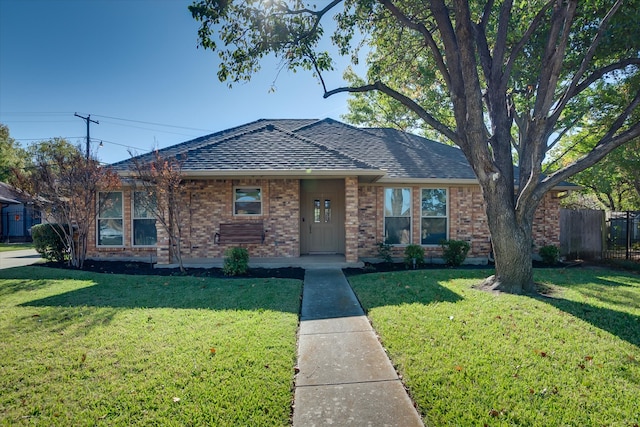 single story home featuring a front yard