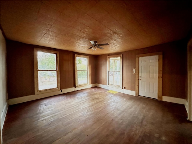 empty room featuring ceiling fan and wood-type flooring