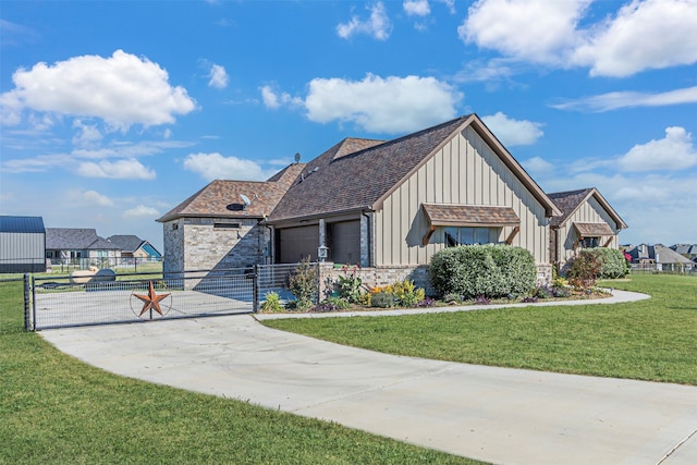 view of front of property with a garage and a front yard