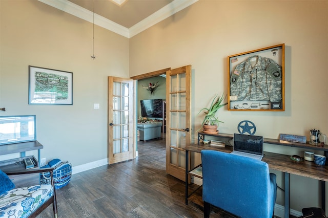 home office featuring french doors, dark hardwood / wood-style floors, ornamental molding, and a high ceiling