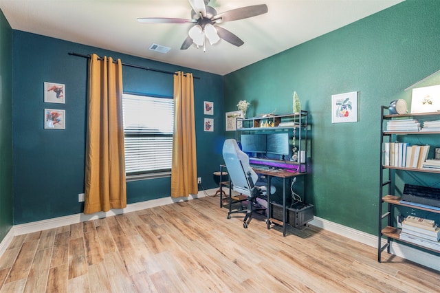 office featuring ceiling fan and light hardwood / wood-style flooring