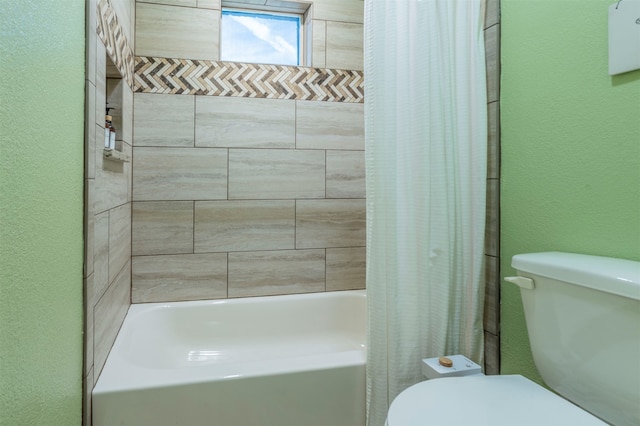 bathroom featuring shower / bathtub combination with curtain and toilet