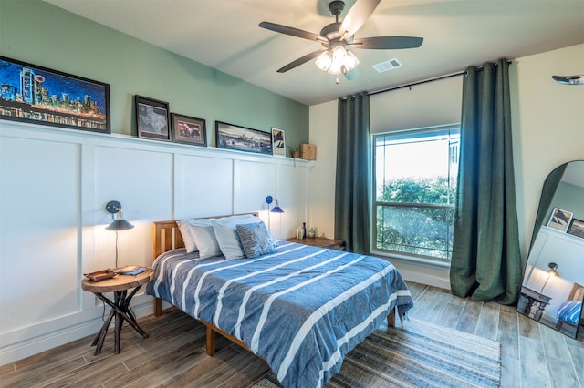 bedroom featuring ceiling fan and wood-type flooring