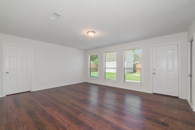 spare room featuring dark hardwood / wood-style floors