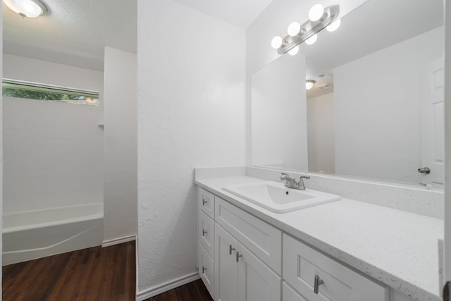 bathroom with vanity and wood-type flooring