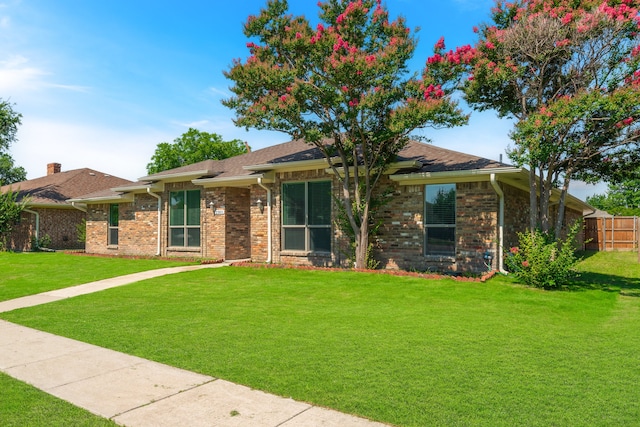 ranch-style house with a front yard