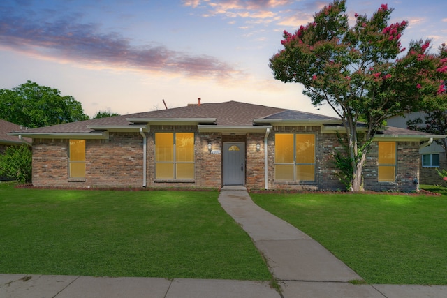 prairie-style home with a lawn