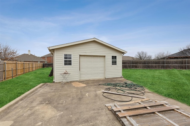 detached garage featuring fence