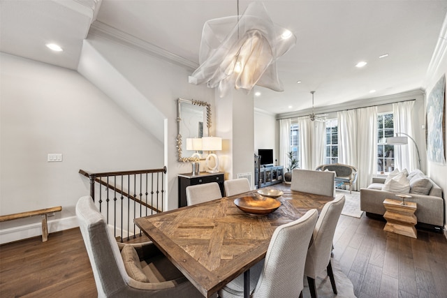 dining area with dark hardwood / wood-style flooring and ornamental molding