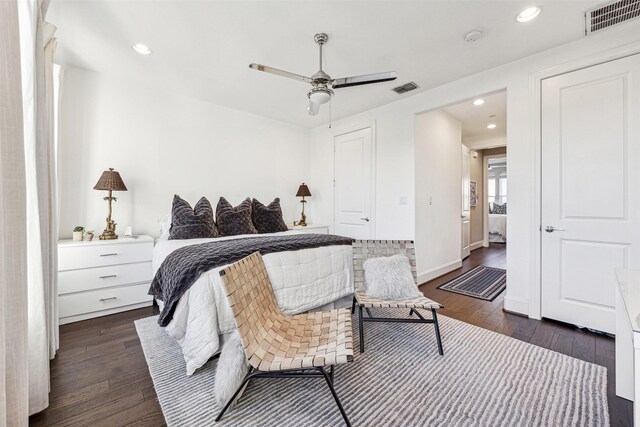 bedroom featuring ceiling fan and dark hardwood / wood-style floors