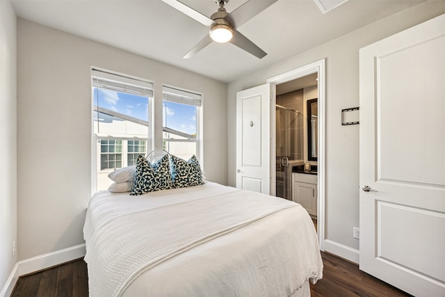 bedroom featuring ceiling fan, dark hardwood / wood-style flooring, and ensuite bath