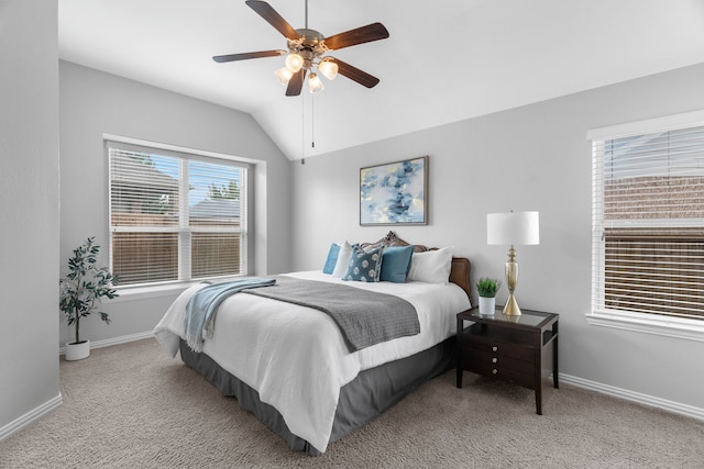 bedroom with light carpet, vaulted ceiling, and ceiling fan