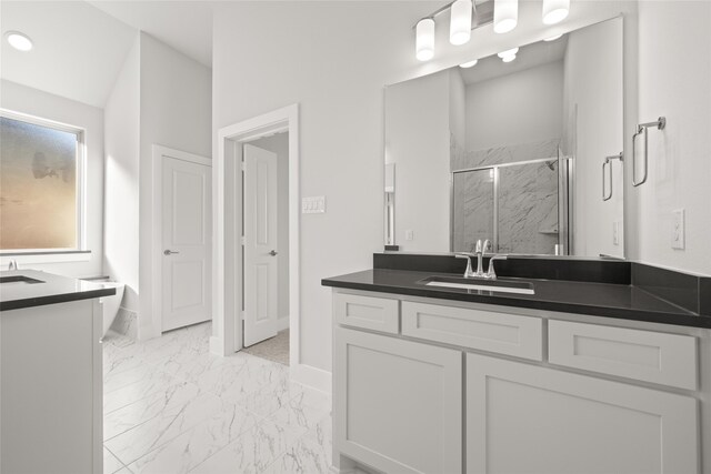 bathroom with vanity and an enclosed shower