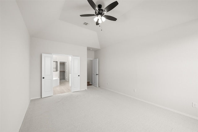 unfurnished bedroom featuring ceiling fan, light carpet, and lofted ceiling