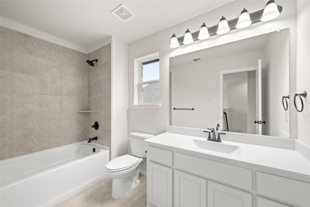 full bathroom featuring tiled shower / bath combo, toilet, tile patterned flooring, and vanity