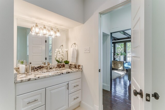 bathroom with vanity and hardwood / wood-style flooring