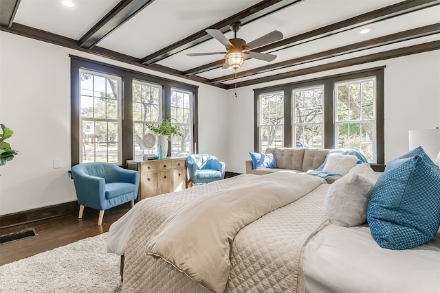 bedroom with multiple windows, ceiling fan, dark hardwood / wood-style flooring, and ornamental molding