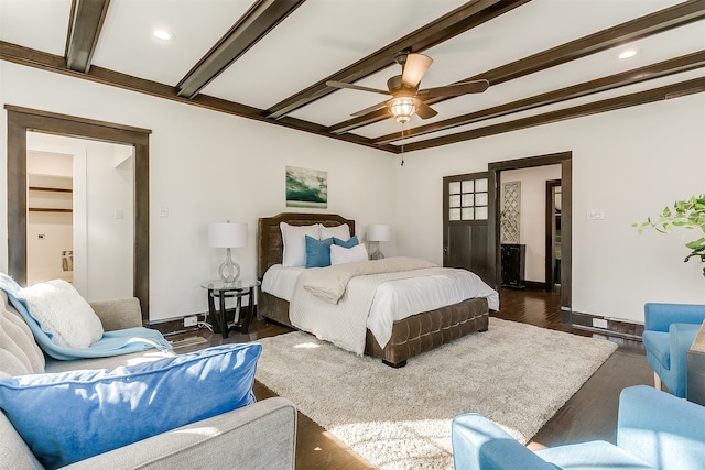 bedroom with ceiling fan, beam ceiling, crown molding, and dark wood-type flooring