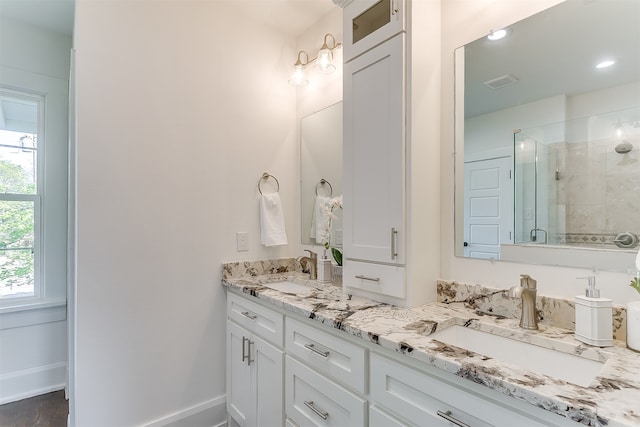 bathroom featuring vanity and walk in shower