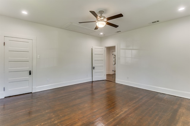 unfurnished room with dark hardwood / wood-style flooring and ceiling fan