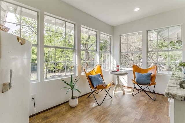 415 Featherston St, Cleburne, TX 76033 - sunroom / solarium featuring plenty of natural light, wood finished floors, baseboards, and recessed lighting