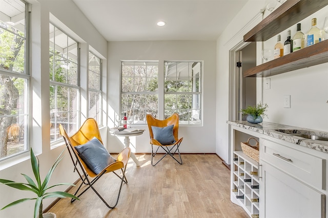 sunroom / solarium featuring sink