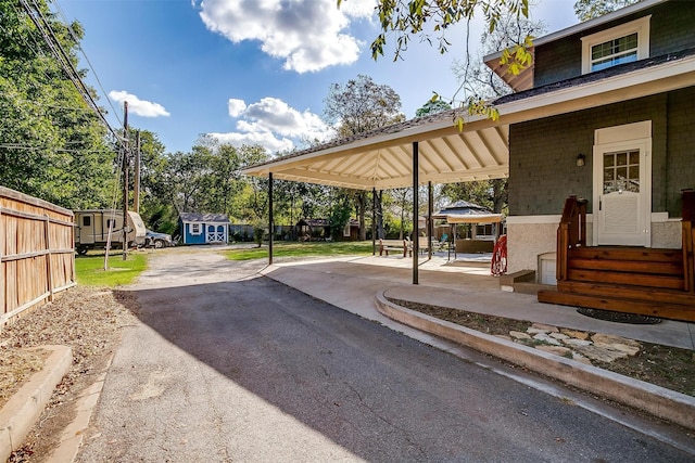 415 Featherston St, Cleburne, TX 76033 - view of asphalt driveway with entry steps