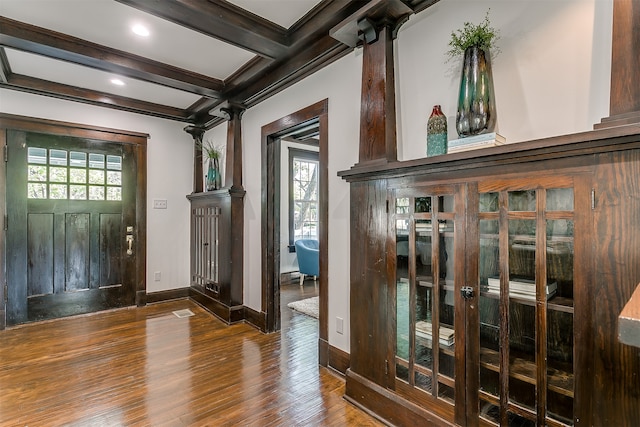 entrance foyer featuring beam ceiling, dark hardwood / wood-style flooring, and coffered ceiling