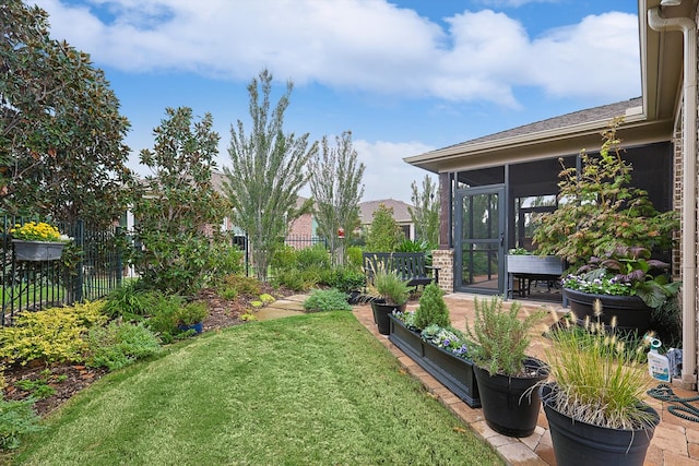 view of yard featuring a sunroom