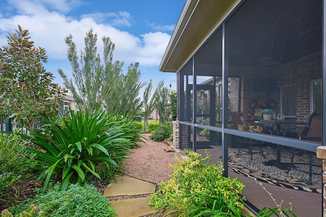 view of yard with a sunroom