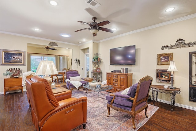 living room with dark hardwood / wood-style floors, ceiling fan, and crown molding