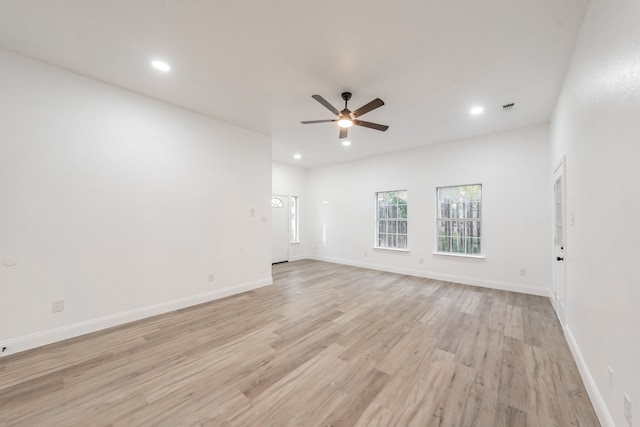 spare room with ceiling fan and light hardwood / wood-style flooring