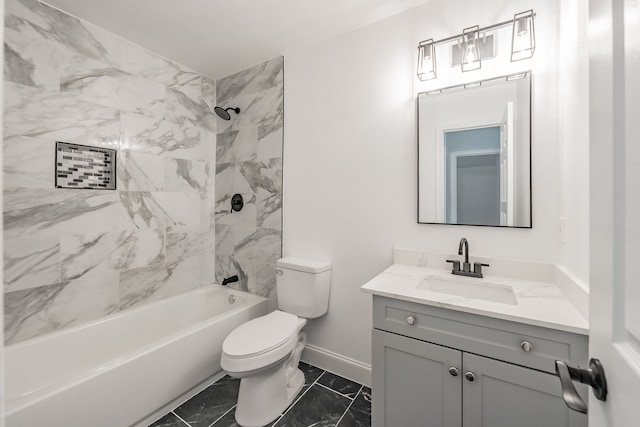 full bathroom featuring vanity, toilet, and tiled shower / bath