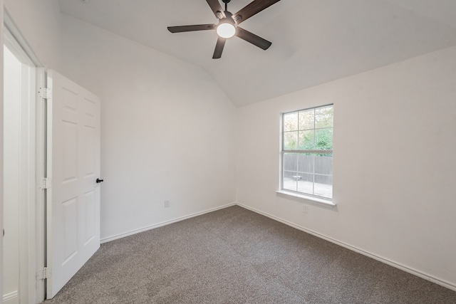 spare room with carpet, ceiling fan, and lofted ceiling