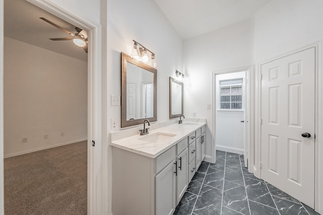 bathroom featuring ceiling fan and vanity