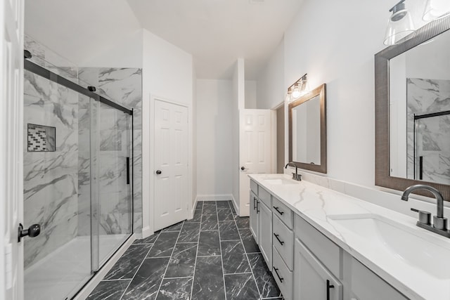 bathroom featuring vanity and a shower with shower door