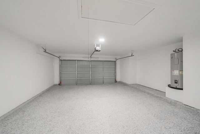 garage featuring electric water heater and a garage door opener